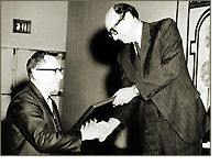 Irving M. Pollack receiving the Distinguished Service Award from Chairman Manuel Cohen, 1967 (left)
