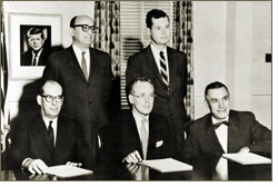 SEC Commission: William L. Cary (seated, center); Manuel F. Cohen (standing, left); J. Allen Frear, Jr. (seated, right); Jack M. Whitney III (standing, right); Byron D. Woodside (seated, left)