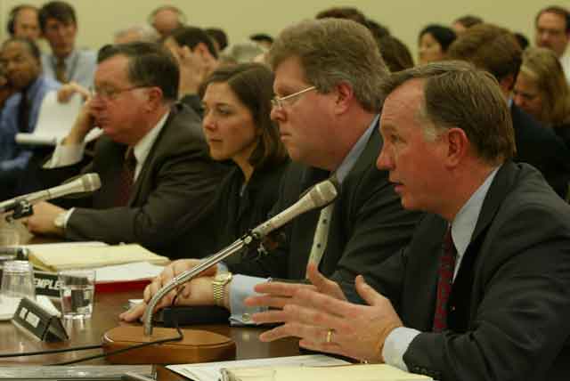 Witnesses from Arthur Andersen accounting firm testify at a Congressional hearing on January 24, 2002.