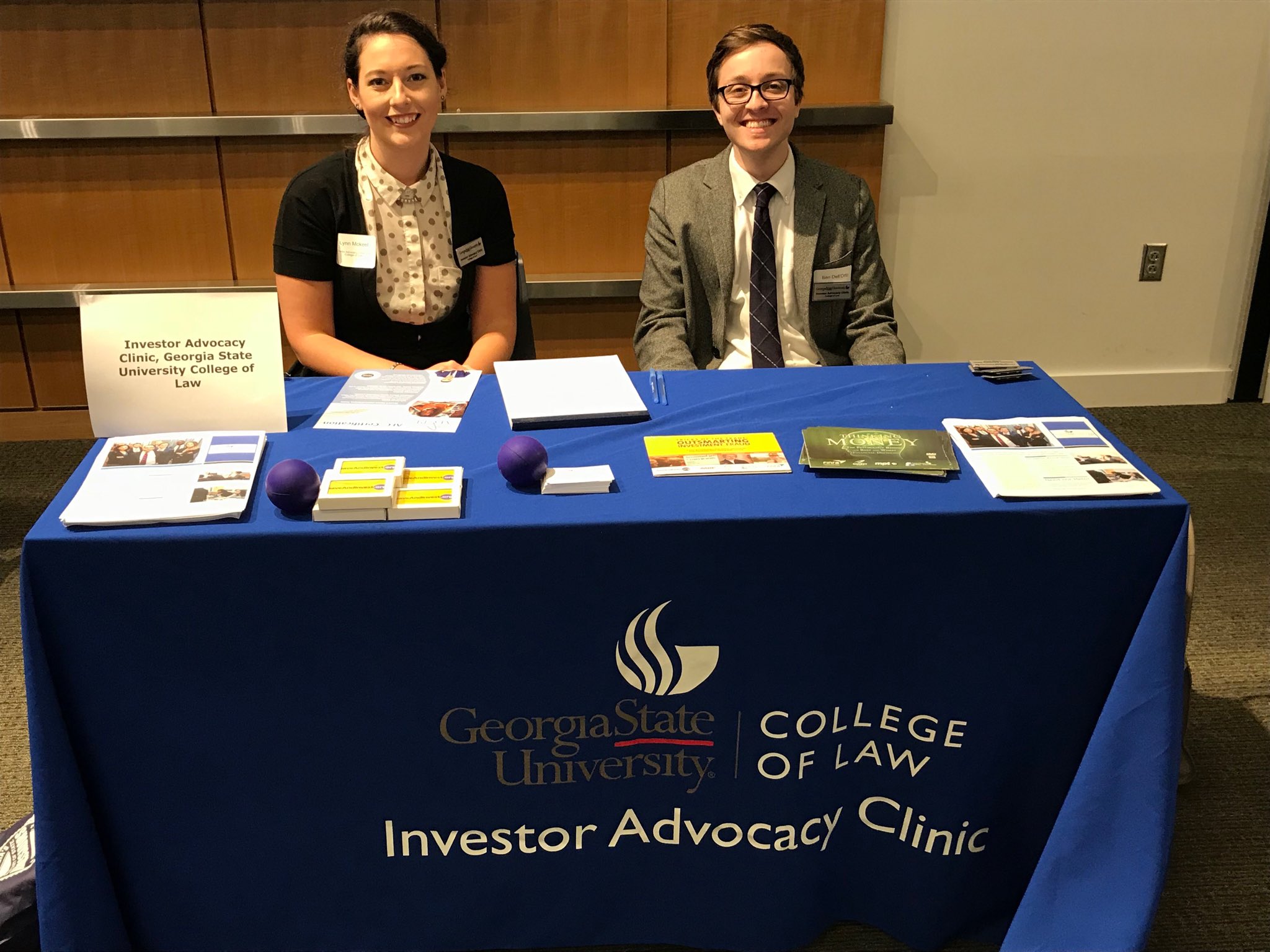 Two students sitting at a desk.