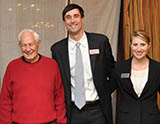 Georgia State University Investor Advocacy Clinic Interns Cassandra Bradford and James Gallagher meet with a resident of the Huntcliff Retirement Community after an investor education presentation and social with attendees.